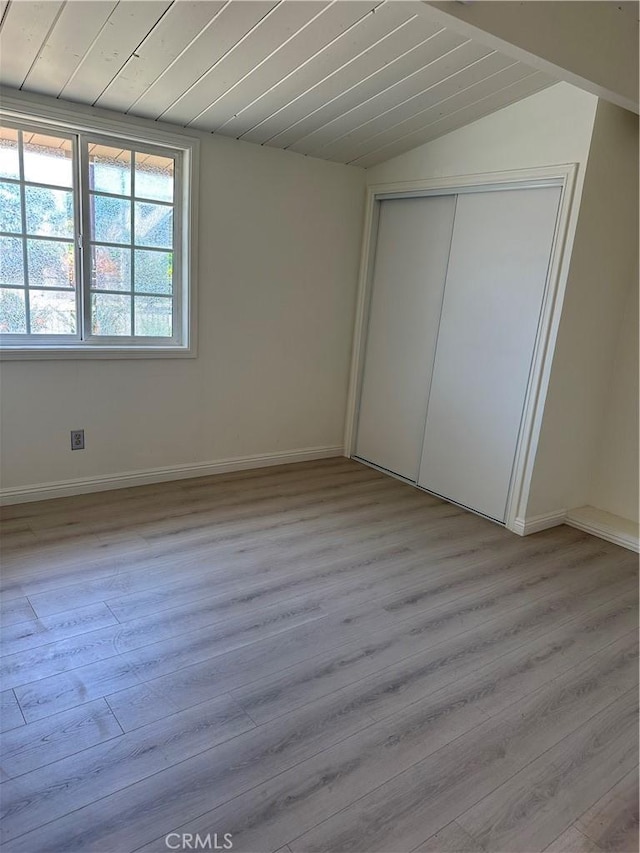 1322 S Walnut Ave, West Covina, CA 91790 - unfurnished bedroom with light wood-style flooring, lofted ceiling, a closet, and wood ceiling