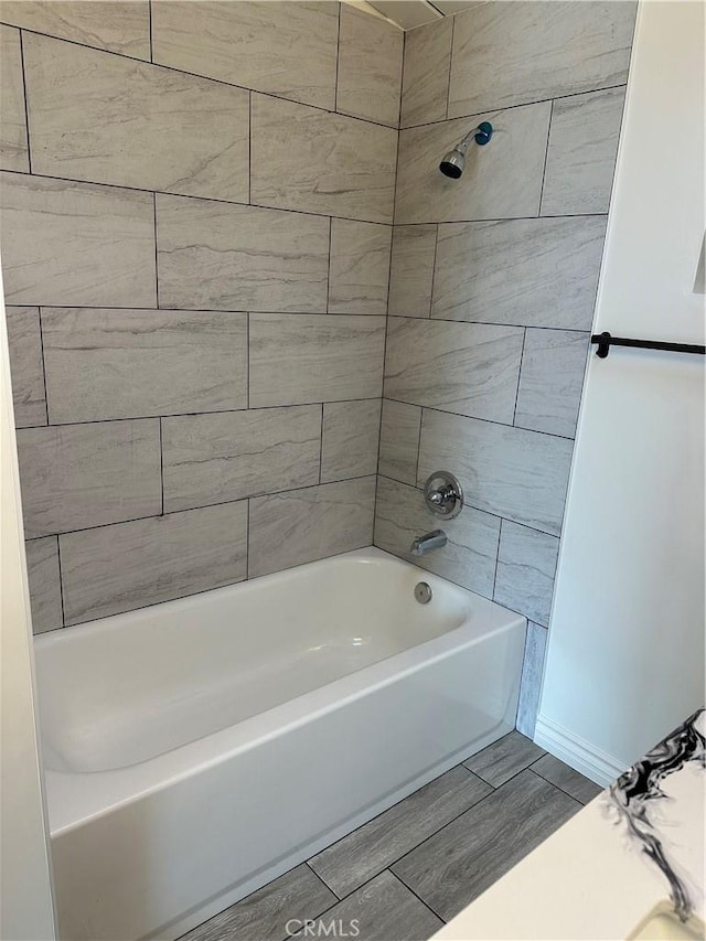1322 S Walnut Ave, West Covina, CA 91790 - bathroom with wood finish floors and shower / washtub combination