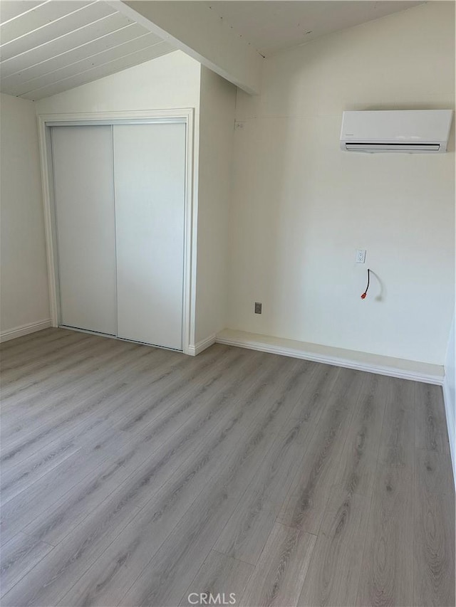 1322 S Walnut Ave, West Covina, CA 91790 - additional living space featuring a wall mounted air conditioner, wood finished floors, and vaulted ceiling
