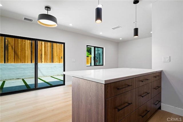 16701 Kalisher, Granada Hills, CA 91344 - kitchen with light wood-style flooring, decorative light fixtures, light countertops, and recessed lighting