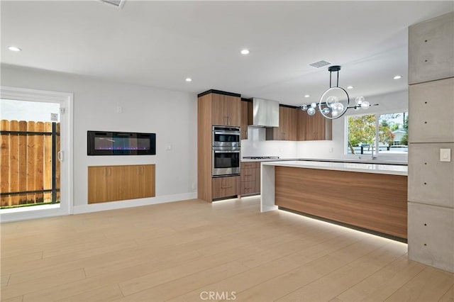 16701 Kalisher, Granada Hills, CA 91344 - kitchen with stainless steel double oven, modern cabinets, a chandelier, light countertops, and brown cabinets