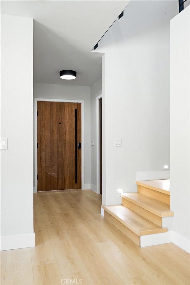 16701 Kalisher, Granada Hills, CA 91344 - hallway with stairs and light wood-style flooring