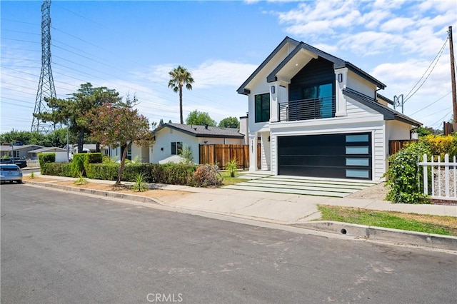 16701 Kalisher, Granada Hills, CA 91344 - modern home with a garage, concrete driveway, and a balcony