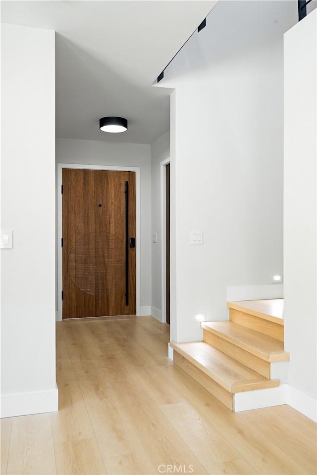 16701 Kalisher, Granada Hills, CA 91344 - hallway with stairway and light wood-style flooring