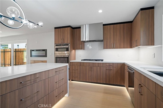 16701 Kalisher, Granada Hills, CA 91344 - kitchen featuring stainless steel appliances, light countertops, modern cabinets, wall chimney exhaust hood, and recessed lighting