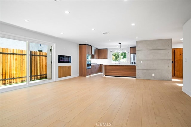 16701 Kalisher, Granada Hills, CA 91344 - unfurnished living room featuring recessed lighting and light wood-style floors