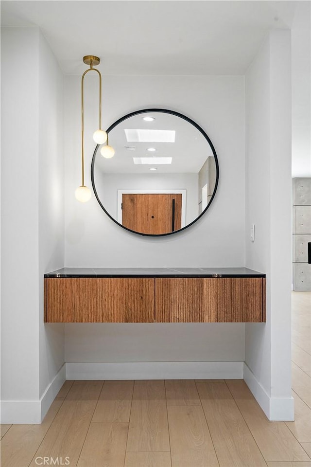 16701 Kalisher, Granada Hills, CA 91344 - bathroom featuring wood finished floors and baseboards