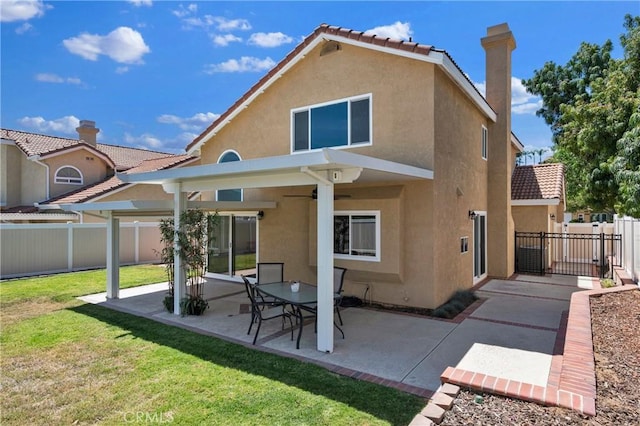 1850 Coolidge St, Corona, CA 92879 - rear view of property featuring stucco siding, a fenced backyard, a patio, and ceiling fan