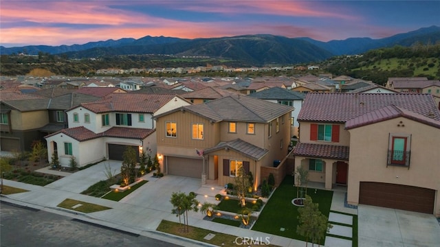 2227 Melogold Way, Corona, CA 92883 - mediterranean / spanish-style home with a garage, concrete driveway, a residential view, a tile roof, and a mountain view