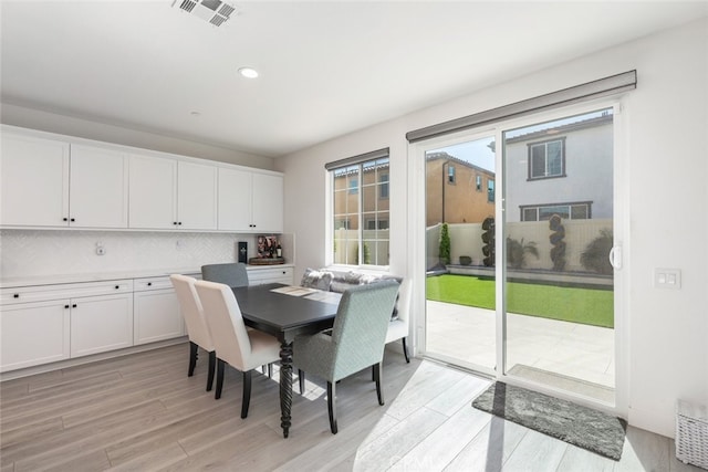 2227 Melogold Way, Corona, CA 92883 - dining space with light wood finished floors and recessed lighting