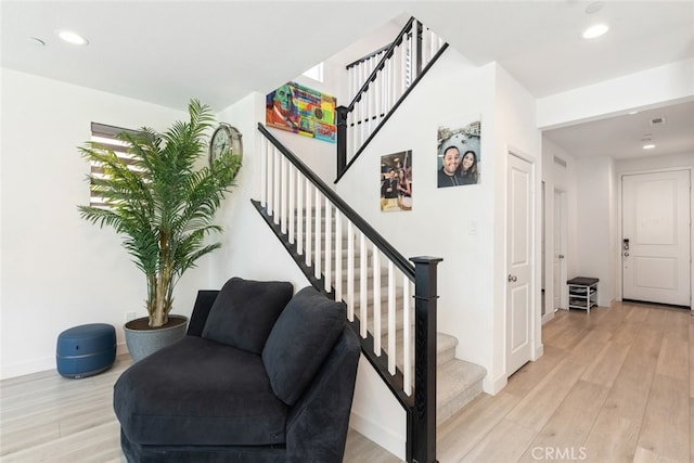 2227 Melogold Way, Corona, CA 92883 - stairway featuring recessed lighting and wood finished floors