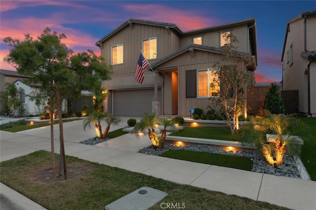 2227 Melogold Way, Corona, CA 92883 - traditional-style house featuring an outdoor fire pit, an attached garage, concrete driveway, board and batten siding, and a front yard