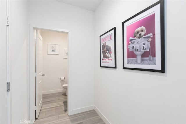 2227 Melogold Way, Corona, CA 92883 - hallway featuring light wood-type flooring and baseboards