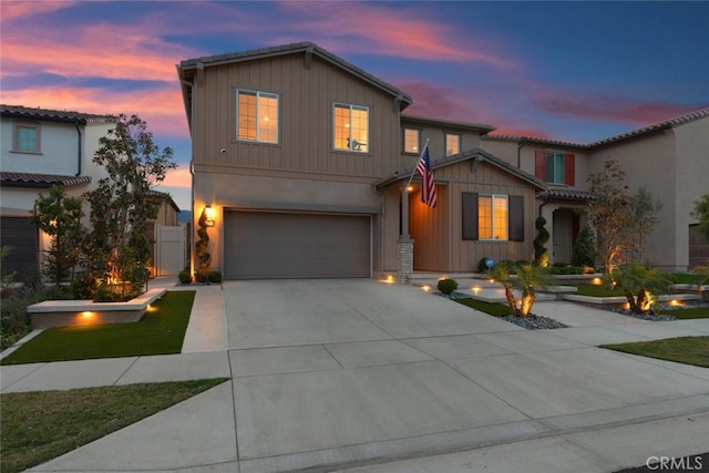 2227 Melogold Way, Corona, CA 92883 - view of front facade featuring a garage, driveway, and board and batten siding