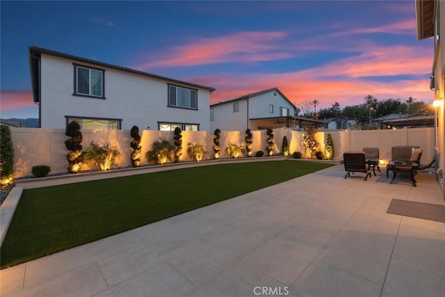 2227 Melogold Way, Corona, CA 92883 - patio terrace at dusk with an outdoor fire pit, a patio, and a fenced backyard