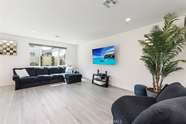 2227 Melogold Way, Corona, CA 92883 - living room featuring light wood finished floors and recessed lighting