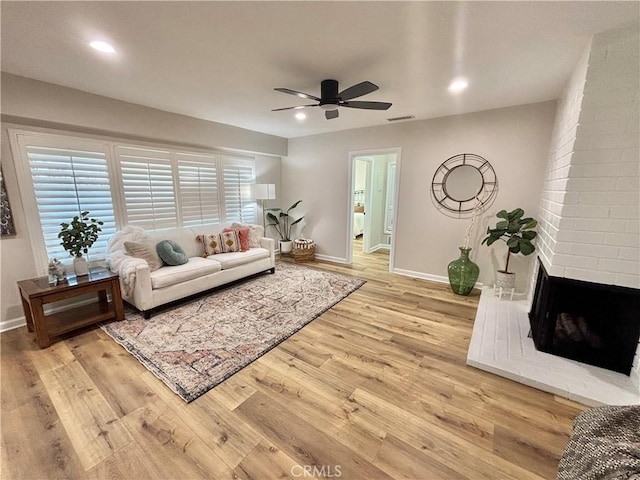 1521 S Pomona Ave Unit A23, Fullerton, CA 92832 - living room with a ceiling fan, wood finished floors, a fireplace, and recessed lighting
