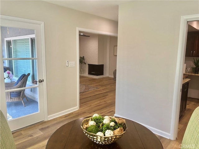 1521 S Pomona Ave Unit A23, Fullerton, CA 92832 - hallway featuring light wood finished floors and baseboards