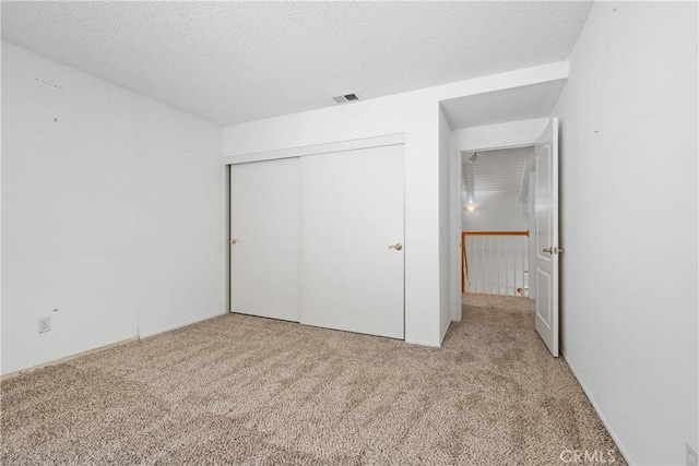 652 Via Zapata, Riverside, CA 92507 - unfurnished bedroom with carpet, a closet, and a textured ceiling