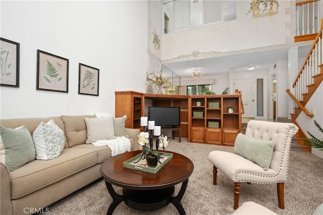 652 Via Zapata, Riverside, CA 92507 - living area with a towering ceiling, stairs, and carpet floors