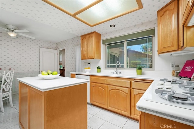 652 Via Zapata, Riverside, CA 92507 - kitchen with wallpapered walls, light tile patterned floors, a kitchen island, dishwasher, and light countertops