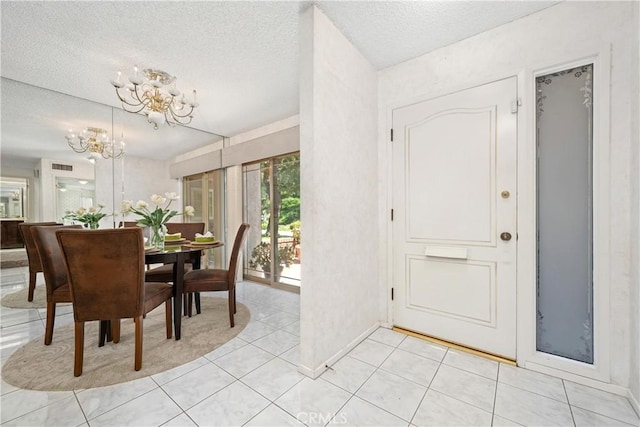 652 Via Zapata, Riverside, CA 92507 - dining area featuring a chandelier, a textured ceiling, and light tile patterned flooring