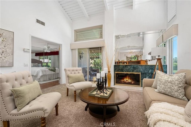 652 Via Zapata, Riverside, CA 92507 - living area featuring high vaulted ceiling, beamed ceiling, plenty of natural light, and a fireplace