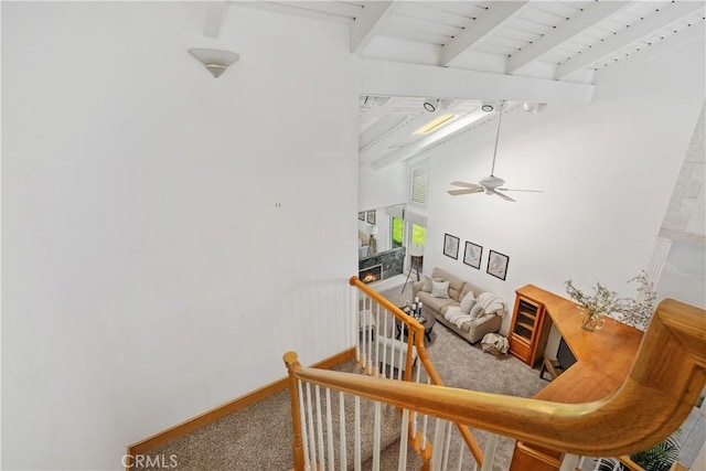 652 Via Zapata, Riverside, CA 92507 - stairs with carpet floors, beam ceiling, a ceiling fan, and a high ceiling