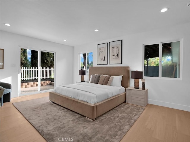 24100 Philiprimm St, Woodland Hills, CA 91367 - bedroom with access to exterior, recessed lighting, and wood finished floors