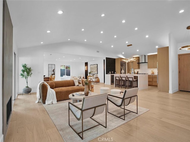 24100 Philiprimm St, Woodland Hills, CA 91367 - living area with vaulted ceiling, light wood-type flooring, and recessed lighting
