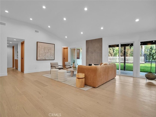 24100 Philiprimm St, Woodland Hills, CA 91367 - living room featuring light wood finished floors, recessed lighting, and vaulted ceiling