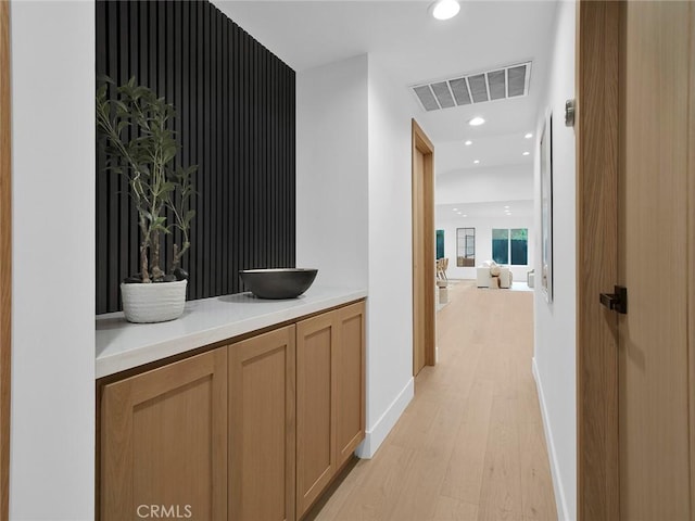 24100 Philiprimm St, Woodland Hills, CA 91367 - hallway with light wood-style flooring and recessed lighting