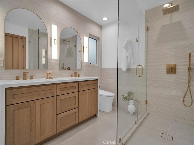 24100 Philiprimm St, Woodland Hills, CA 91367 - full bath with tile patterned flooring, double vanity, a shower stall, tile walls, and recessed lighting