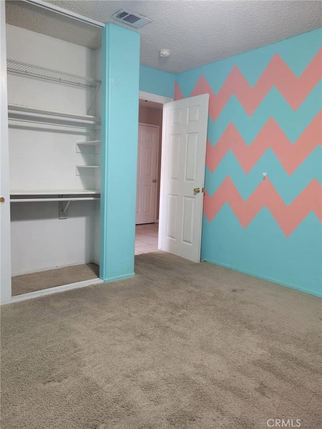 441 River Vly, Blythe, CA 92225 - unfurnished bedroom with carpet floors, a textured ceiling, and a closet