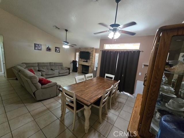 441 River Vly, Blythe, CA 92225 - dining space with ceiling fan, light tile patterned flooring, a fireplace, and vaulted ceiling