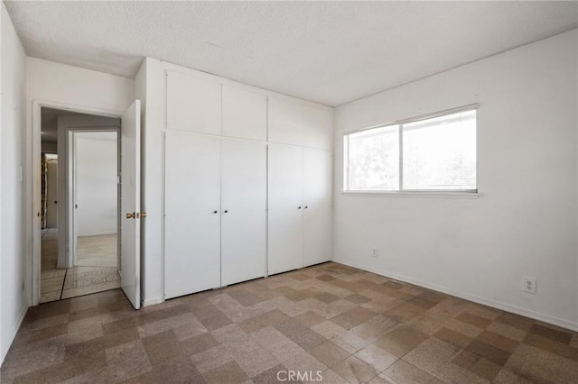8 Coveview Dr, Rancho Palos Verdes, CA 90275 - unfurnished bedroom with baseboards and a closet
