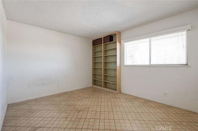 8 Coveview Dr, Rancho Palos Verdes, CA 90275 - empty room featuring a textured ceiling