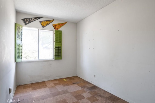 8 Coveview Dr, Rancho Palos Verdes, CA 90275 - empty room featuring a textured ceiling and tile patterned floors