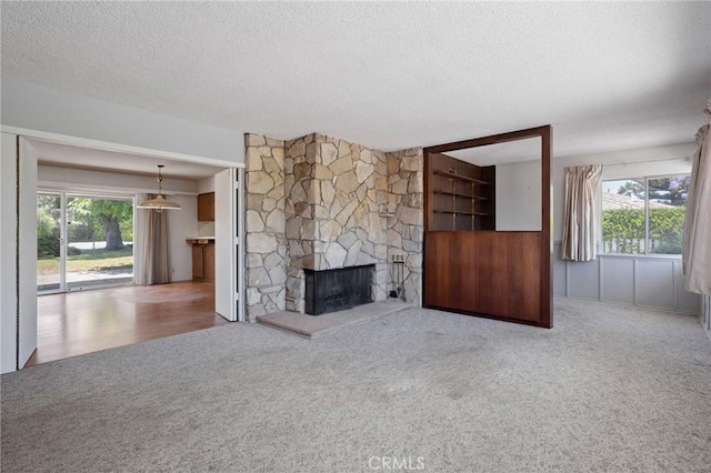 8 Coveview Dr, Rancho Palos Verdes, CA 90275 - unfurnished living room with a textured ceiling, carpet floors, and a fireplace