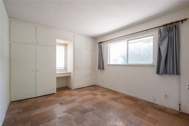 8 Coveview Dr, Rancho Palos Verdes, CA 90275 - unfurnished bedroom with light flooring and a textured ceiling