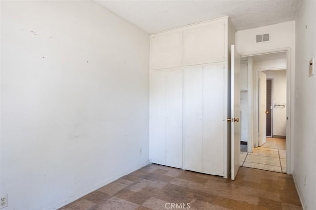 8 Coveview Dr, Rancho Palos Verdes, CA 90275 - unfurnished bedroom featuring a closet and tile patterned floors