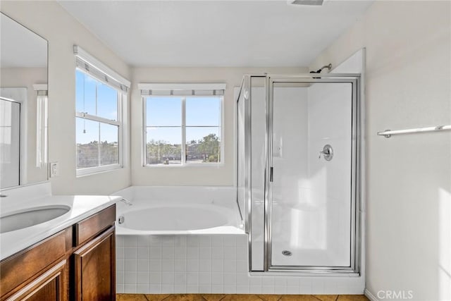 27132 Golden Field Ct, Moreno Valley, CA 92555 - full bathroom featuring vanity, a stall shower, and a bath