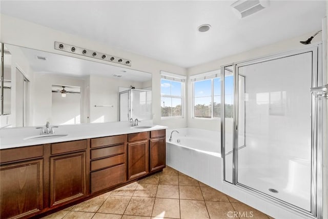 27132 Golden Field Ct, Moreno Valley, CA 92555 - bathroom featuring a garden tub, double vanity, a shower stall, ceiling fan, and tile patterned flooring