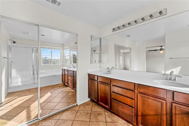 27132 Golden Field Ct, Moreno Valley, CA 92555 - full bath featuring double vanity, a garden tub, tile patterned floors, a shower with shower door, and a ceiling fan