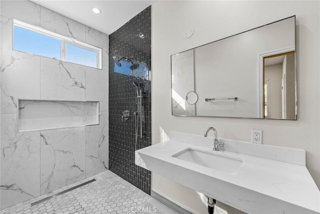 27132 Golden Field Ct, Moreno Valley, CA 92555 - bathroom featuring tiled shower, vanity, and recessed lighting