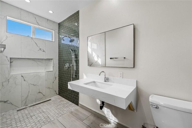 27132 Golden Field Ct, Moreno Valley, CA 92555 - full bathroom featuring a marble finish shower and recessed lighting