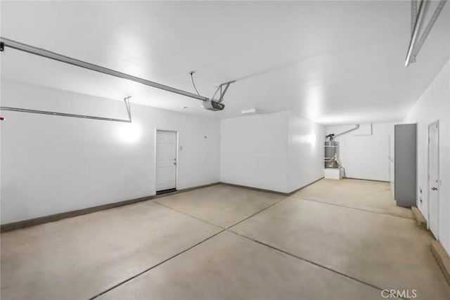 27132 Golden Field Ct, Moreno Valley, CA 92555 - garage featuring strapped water heater and a garage door opener