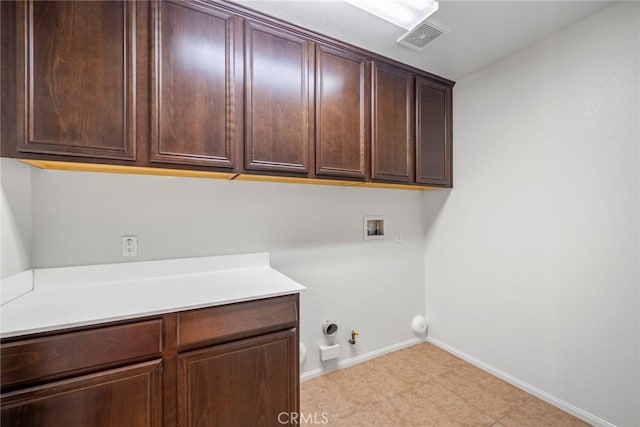 27132 Golden Field Ct, Moreno Valley, CA 92555 - laundry room featuring gas dryer hookup, cabinet space, and hookup for a washing machine
