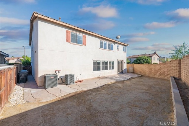 27132 Golden Field Ct, Moreno Valley, CA 92555 - back of house featuring a patio area, a fenced backyard, and stucco siding
