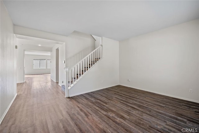 27132 Golden Field Ct, Moreno Valley, CA 92555 - unfurnished living room featuring stairs and wood finished floors